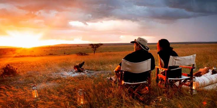 couples out side aluxury lodge