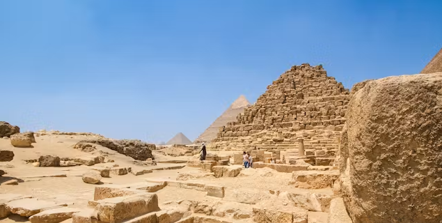 Visiting the Pyramids of Giza in Egypt with the Great Pyramid in the background