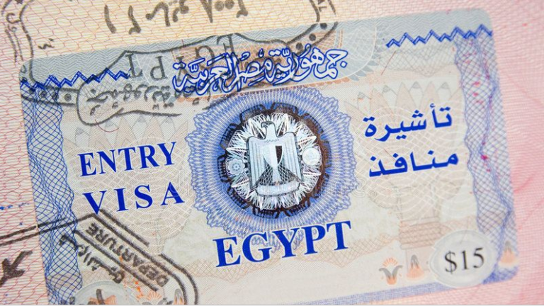 International travelers arriving at Cairo International Airport and preparing to complete immigration procedures for entry into Egypt.