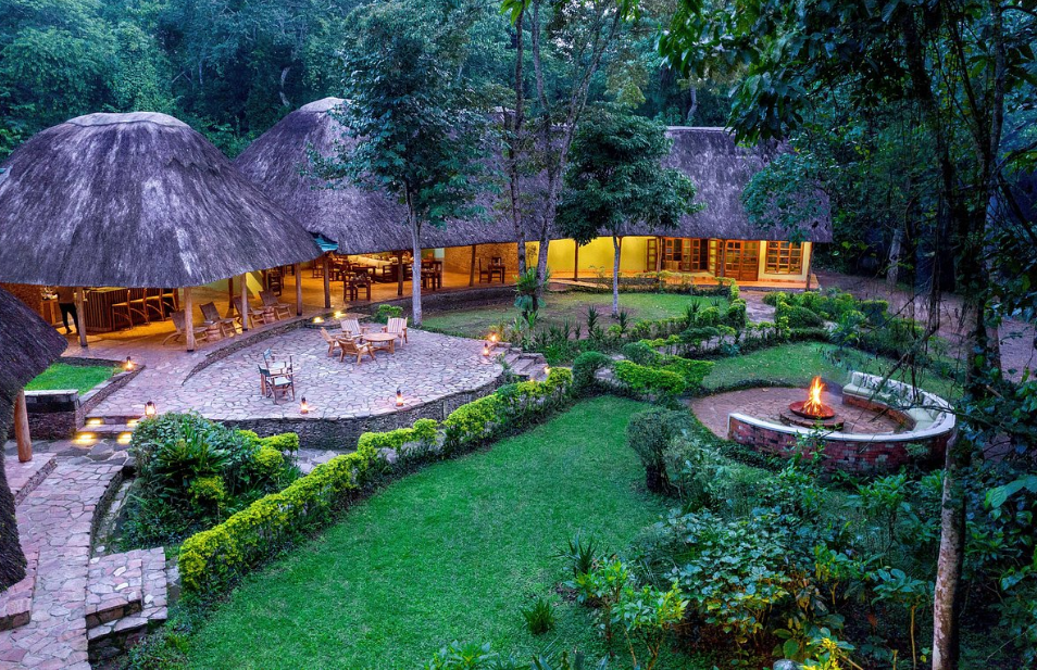 campfire at a uganda safari campsite under the stars