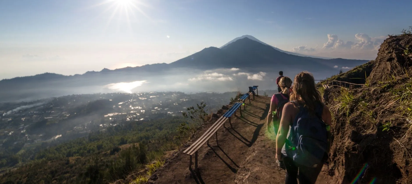 Trekkers departing at sunrise on a gorilla trek in Volcanoes National Park Rwanda