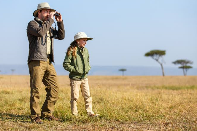 a father and son on an african safari
